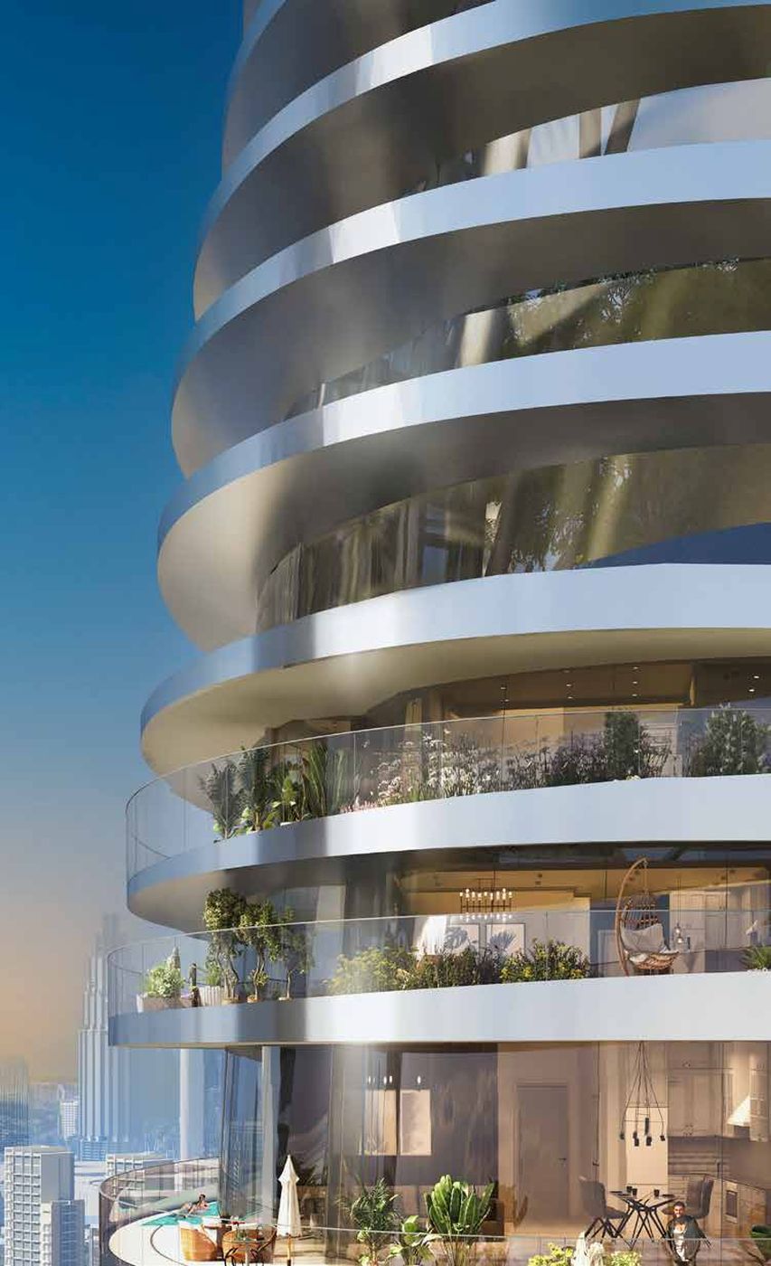 Fachada de Canal Crown con balcones curvos y vegetación
