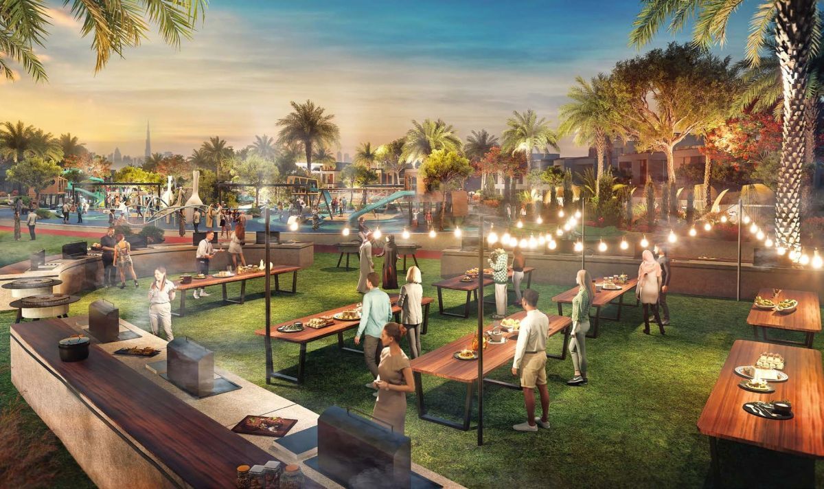 Damac Riverside Views, Dubái: zona de barbacoa de noche con el Burj Khalifa
