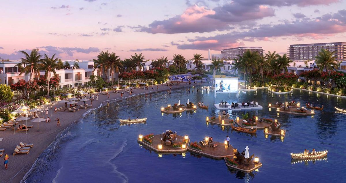 Damac Riverside Views, Dubái: laguna con cine flotante al atardecer