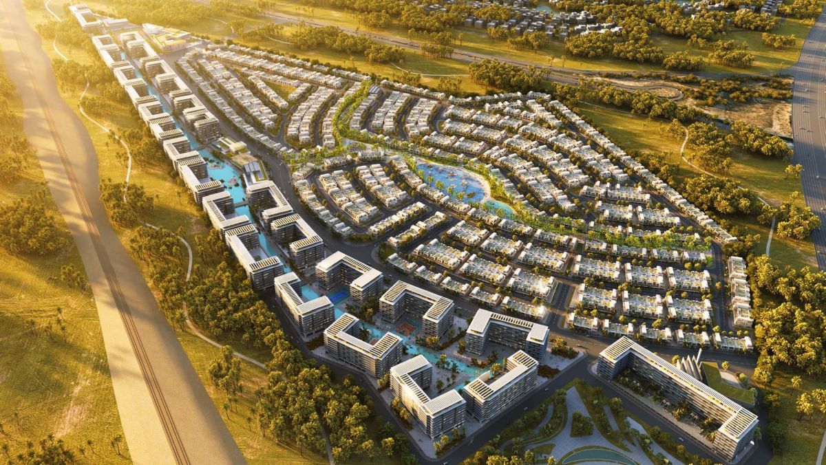Damac Riverside Views, Dubái: vista aérea al atardecer con edificios y canal